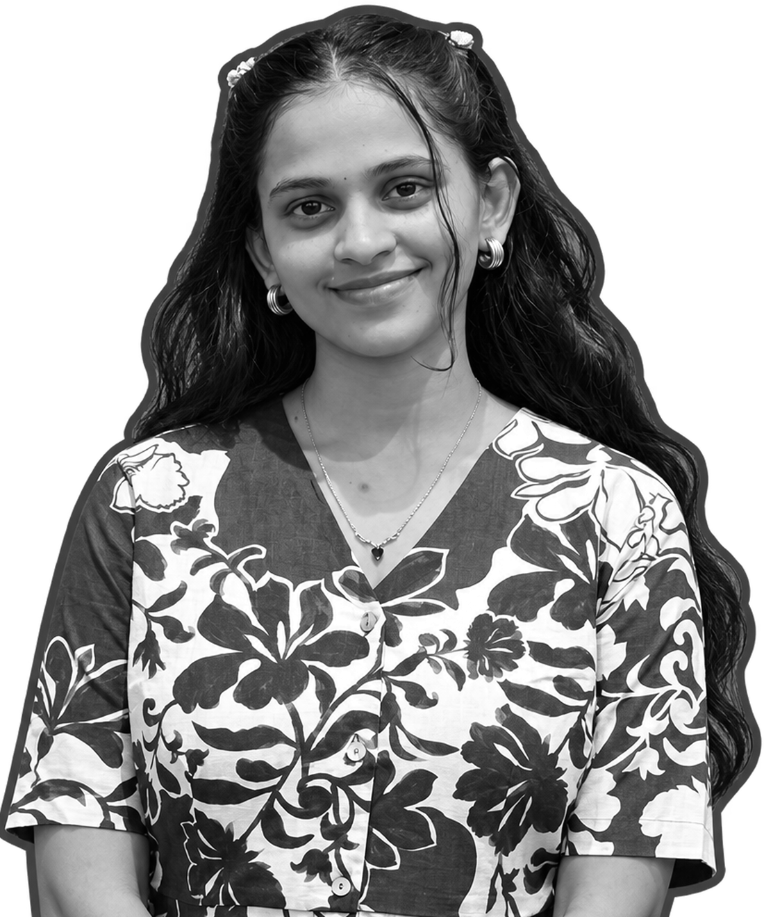 Gangadevi, smiling, in a floral top